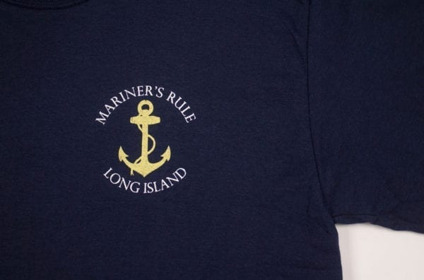 Close up of blue shirt with anchor design