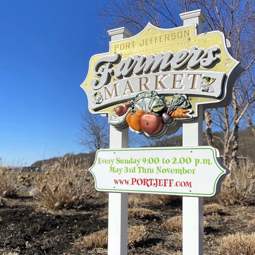 Port Jefferson Farmers Market sign with produce